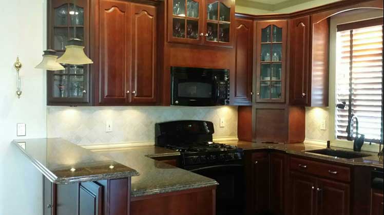 The same kitchen sports black appliances professionally installed by Foskey Construction.